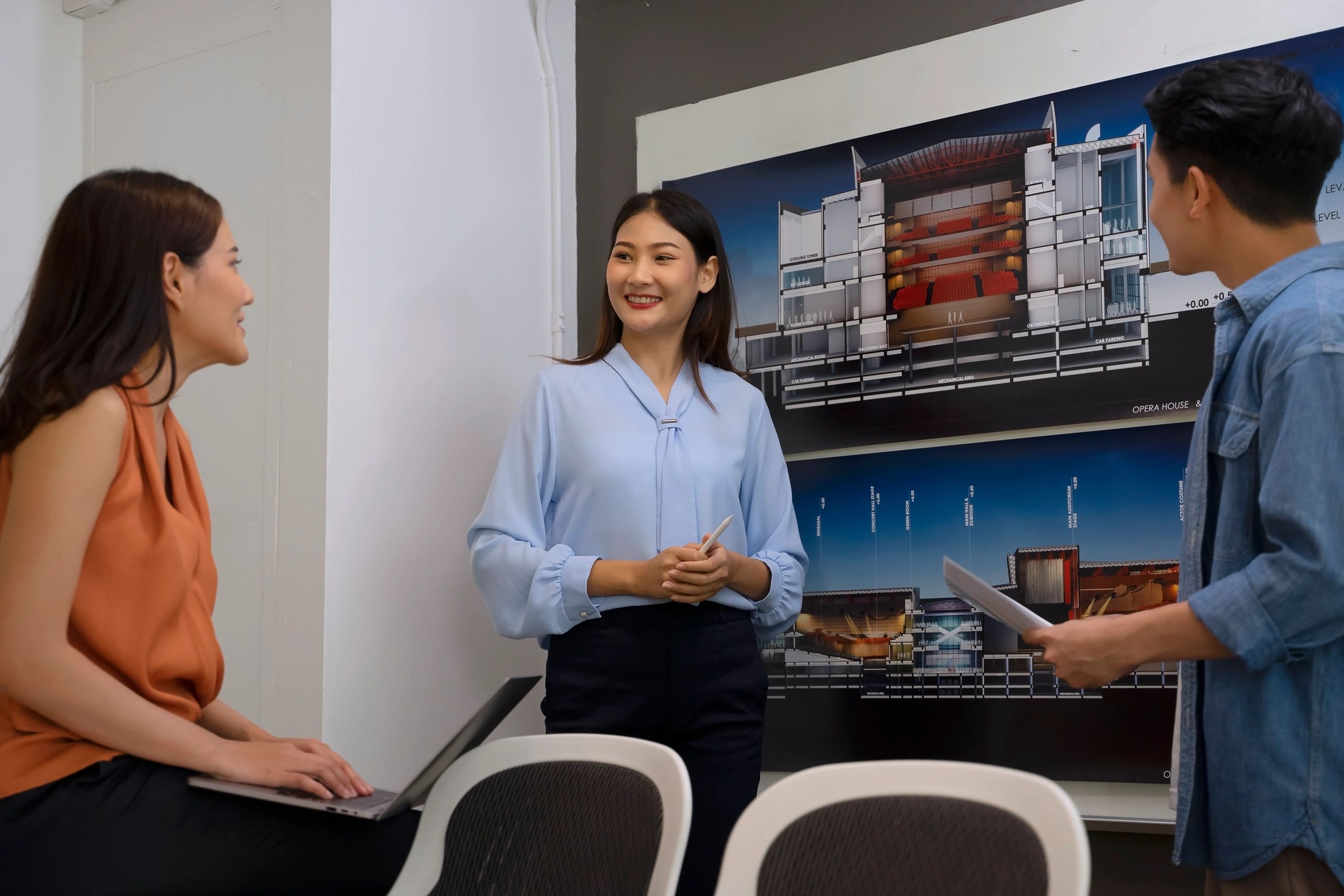 Engineering professionals collaborating in an office