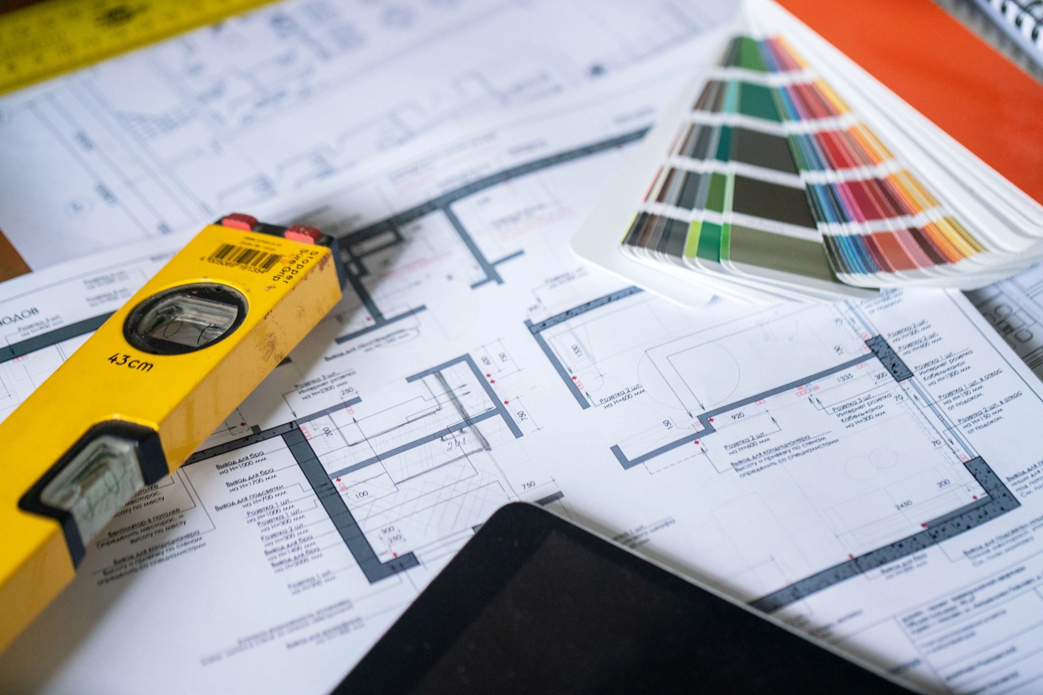 Architectural plans and engineering tools on a desk
